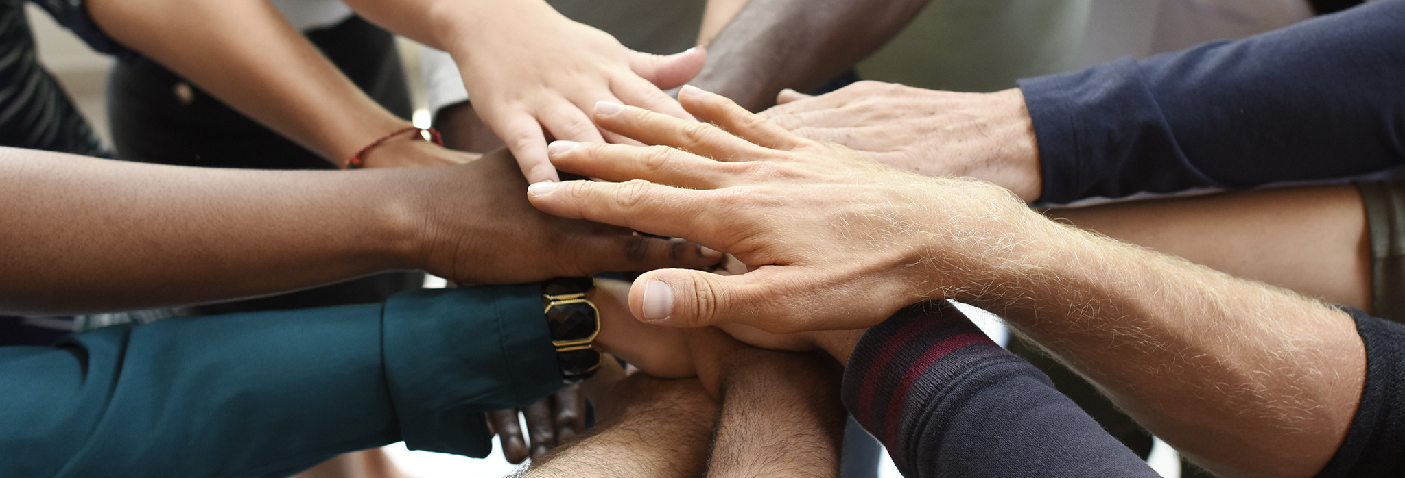 People holding hands to signify diversity equality inclusion. People holding hands to signify diversity equality inclusion.